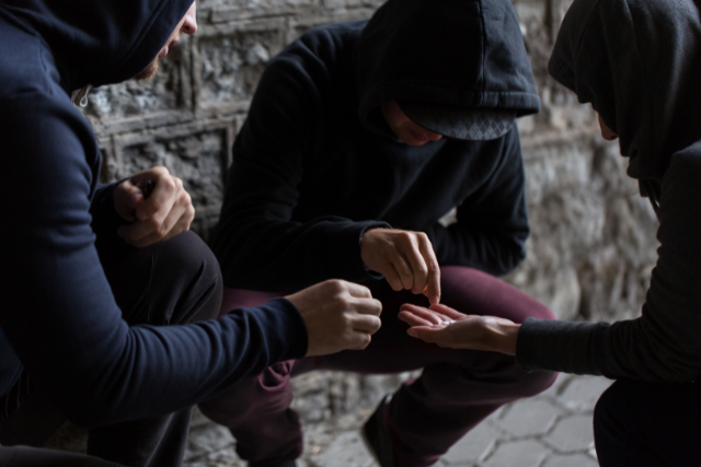 group of men taking drugs