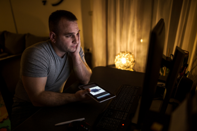 guy using pc in the dark